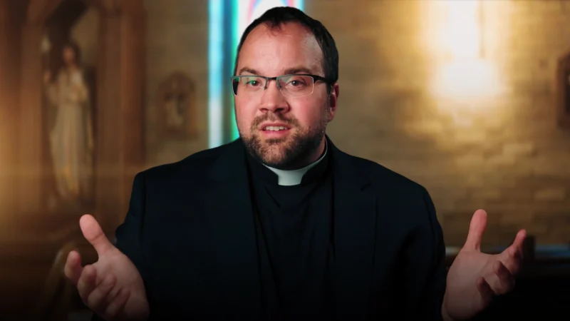 Father Edward asking the question Are Science and God At Odds?