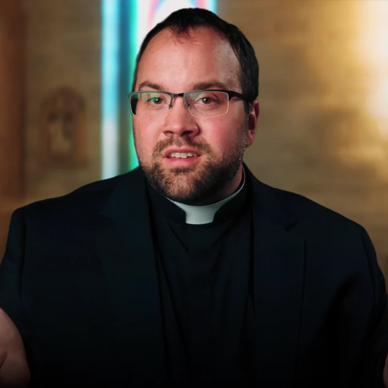 Father Edward asking the question Are Science and God At Odds?